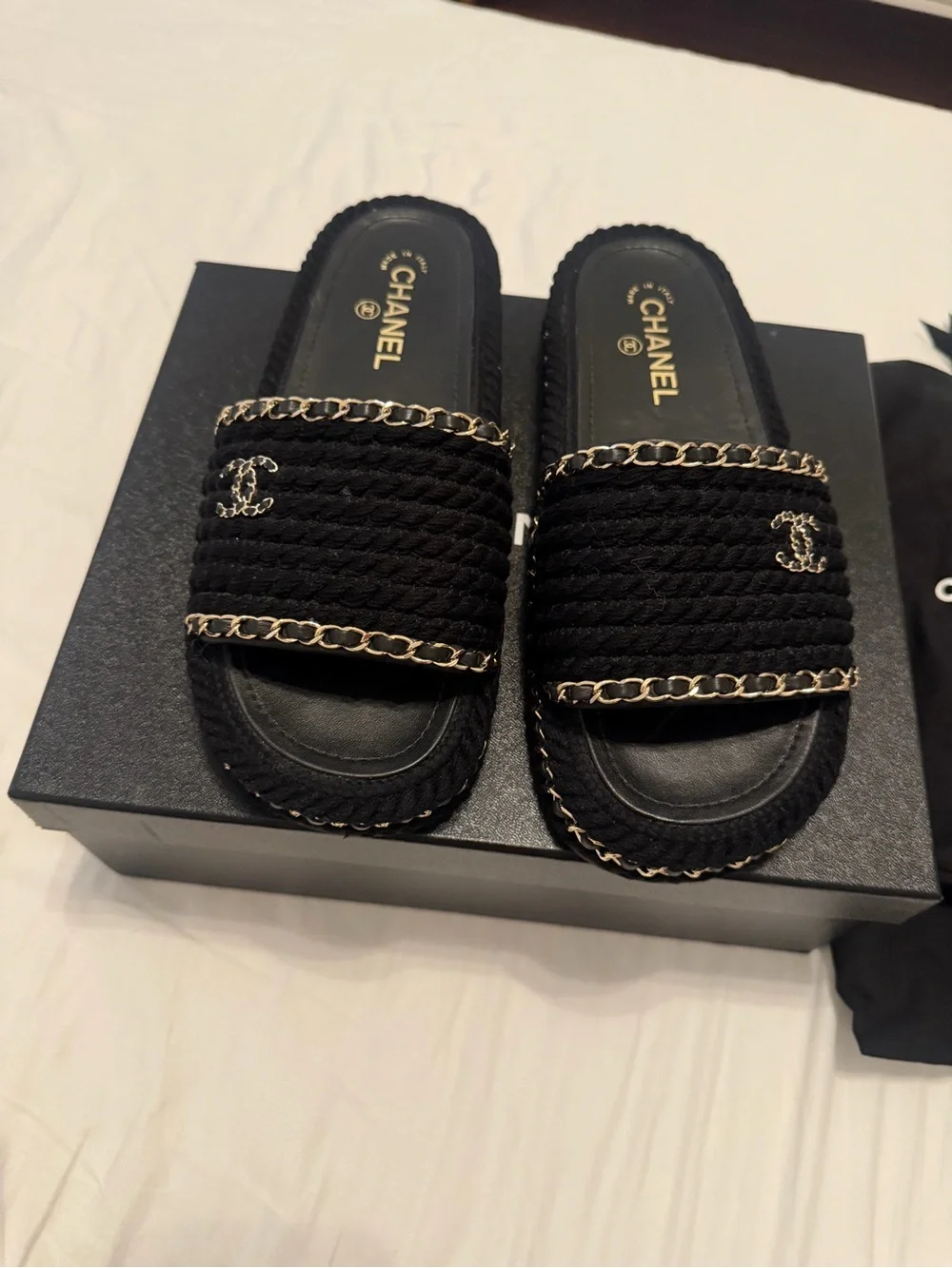 CHANEL Black Braided Slides with Gold Chain Accents